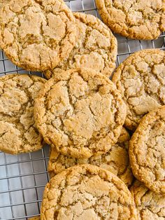 a bunch of cookies sitting on top of a cooling rack