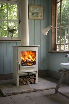 a wood burning stove in a blue room