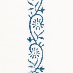 a blue and white embroidered design on a white background