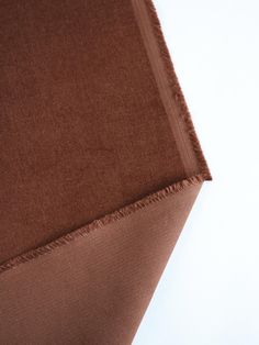 the corner of a piece of brown fabric