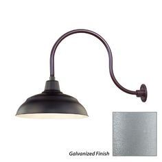 an image of a wall light with a metal shade on the side and a white background