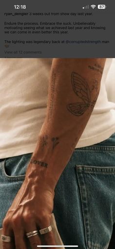 a man's arm with tattoos on it, and the text above him reads