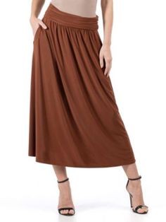 Discover the perfect blend of comfort and style with the 24seven Comfort Apparel Womens Foldover Maxi Skirt With Pockets. This versatile and chic skirt is a must have addition to your wardrobe. With four stunning color options to choose from, you can effortlessly express your personal style. The foldover waistband and pleated waist add a touch of sophistication, while the flowy A line shape creates a flattering and feminine silhouette. With added functional pockets, that ensure convenience without compromising on style. Whether you are dressing it up for a night out or keeping it casual for a day of errands, this maxi skirt guarantees all day comfort and endless compliments. Elevate your fashion game with the Foldover Maxi Skirt With Pockets and experience the perfect combination of style, Maxi Skirt With Pockets, Chic Skirt, Midi Skirt With Pockets, Chic Skirts, Womens Maxi Skirts, Feminine Silhouette, Skirt With Pockets, Hem Style, Bottom Clothes