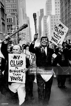 Anti-nuclear march with two marchers wearing Nikita Khrushchev and John F Kennedy masks, carrying placards reading 'My club is bigger than yours', in New York City, New York, circa 1975. (Photo by Steve Schapiro/Corbis via Getty Images) Steve Schapiro, City New York, York City, New York City, New York, Reading