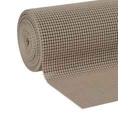 a roll of beige fabric on a white background