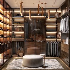 a walk in closet filled with lots of clothes and shoes on shelves next to a round ottoman