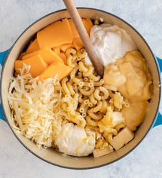 macaroni, cheese and other ingredients in a pot