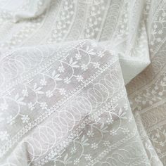 white lace fabric with flowers on it