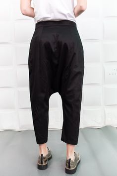 "Black Harem Pants, Cyberpunk Clothing, Drop Crotch Pants These comfortable baggy pants have a drop crotch design an are with an ankle length so these relaxed black cotton pants will make your style trendy and unique and keep you comfortable in your daily activities. ------------------------------------------------ FEATURES: 🌟 Made of cotton fabric 🌟 Two pockets on each side 🌟 Sizes from XS to 5XL - plus sizes available, please write us /the model is wearing size S/ 🌟 Available in black, whi Alternative Style Black Trousers, Alternative Style Black Baggy Bottoms, Punk Baggy Bottoms For Alternative Fashion, Black Straight Harem Pants For Streetwear, Baggy Punk Bottoms With Pockets, Black Parachute Pants For Alternative Fashion, Edgy Baggy Wide Leg Bottoms, Punk Style Baggy Bottoms With Pockets, Alternative Style Wide Leg Cargo Pants