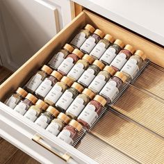 an open drawer with spices in it