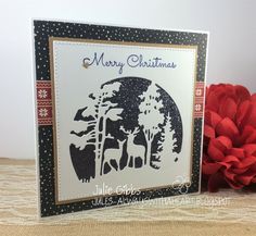 a christmas card with an image of deer in the woods