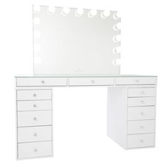 a white dressing table with drawers and a large mirror on the wall above it,