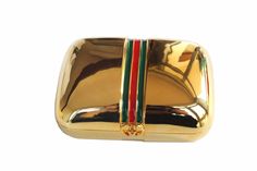 Vintage 1980 GUCCI, made in Italy, travel soap case. Rectangular domed shape in gold tone metal, with red and green three stripe enamel on the front, pressure-free closure with double G logo. Signed Gucci Italy on the back. New condition, unused, delivered with original packaging. Ref.: OB1177 Dimensions: Height: 6.50 cm. | Width: 9.00 cm. | Depth: 3.00 cm. | Condition: New, unused  More vintage items in my online shop: http://www.vintagecarwen.com Gold Tone Metal, Dish Soap, Vintage Gucci, Gold Tones, Soap, Vintage Items, Gucci, Signs, Accessory Gift