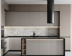 a modern kitchen with marble counter tops and cabinets