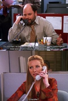 a woman talking on a phone while sitting at a desk