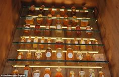 the shelves are filled with honey bottles and jars