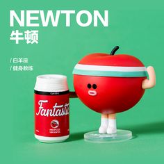 a plastic apple with a can of fantassa on it's side and the caption says newton