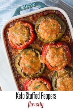 a casserole dish with stuffed peppers and cheese