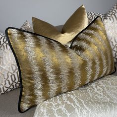 "ALL OF OUR CUSHION COVERS ARE HANDMADE USING ONLY THE BEST QUALITY DESIGNER BRAND FABRICS, TO PROVIDE LUXURY , AFFORDABLE CUSHION COVERS TO DECORATE YOUR HOME" Introduce: JULES Stunning textured fabric in tones of ochre - gold with contrasting black satin piping.  Due to variations in computer screens, we cannot guarantee that colours shown here are truly representative of our products. Returns and Refunds: We do not accept returns as all items are handmade to order. Samples available  Delivery Gold Pillow Covers, Gold Color Palettes, Satin Noir, Luxury Cushions, Gold Luxury, Gold Pillows, Black Families, Cover Pillow, Textured Fabric