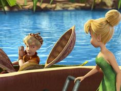 the tinkerbells are riding in a boat together