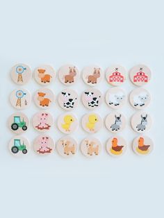 a collection of buttons with farm animals on them, all in different shapes and sizes