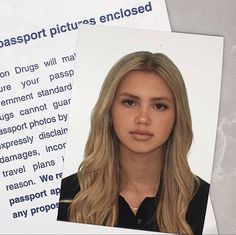 an image of a woman with long blonde hair on top of a passport and some papers