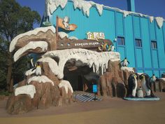 the penguins are standing in front of the ice cave at disney's animal kingdom