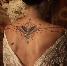 a woman with a tattoo on her back