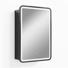 a mirror mounted to the side of a wall next to a white wall with a black frame