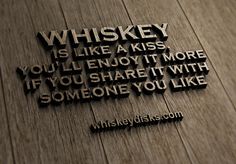 a wooden wall with a quote on it that says whiskey is like a kiss you'll enjoy it more if you share it with someone you like