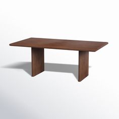 a wooden table on a white background with no one around it or the table is empty