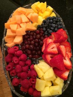 a platter filled with different types of fruit