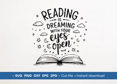 an open book with the words reading is dreaming with your eyes open and stars above it