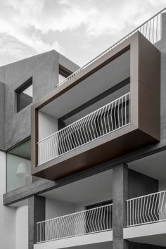 an apartment building with balconies and balconyes on the second floor is shown in black and white