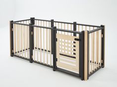 a baby crib that is made out of wood and has two sides open to show the