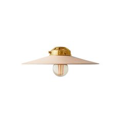 a light that is on top of a white wall mounted lamp with a gold finish