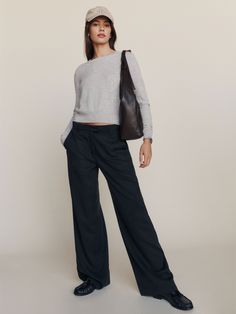 Power pants. Shop the Petites Carter Mid Rise Pant from Reformation, a mid-rise full-length pant with a relaxed fit. Womens Suit Pants Outfit, Parisian Style Petite, Relaxed Fit Trousers Women, Black Womens Dress Pants, Mid Rise Trousers Outfit, Copenhagen Work Style, Dressing Down Dress Pants, Pleated Pants Outfit Women, Masc Business Casual Women