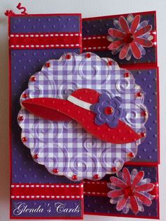 a close up of a greeting card with flowers and a hat on the front side