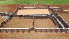 an aerial view of a horse barn with stalls and stalls in the middle of it