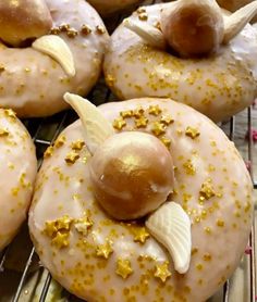 some donuts with icing and gold sprinkles