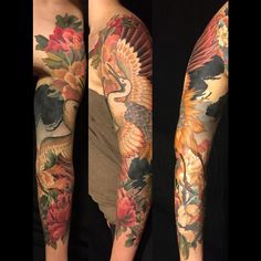 the arm is covered with colorful tattoos and has an eagle on it's back