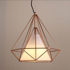 a light hanging from the ceiling in a room