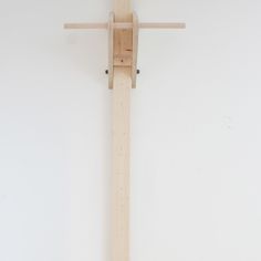 a wooden cross hanging on the wall