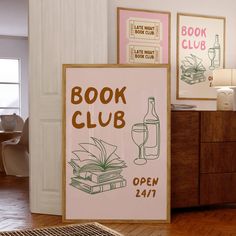 a book club sign sitting on top of a hard wood floor next to a wooden dresser