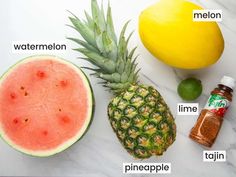 pineapple, melon, watermelon, lime, lemon and pepper on a marble counter top