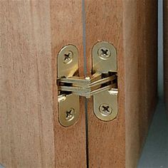 two wooden doors with metal latches on them