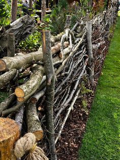 a fence made out of branches and logs