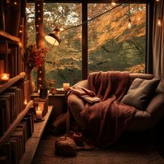 a cozy living room with candles and blankets