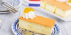 a piece of cake on a blue and white plate with a flag sticking out of it