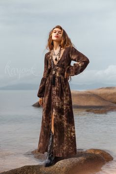 Introducing our gorgeous Brown Tie Dye Maxi Dress, a stunning combination of boho-chic and comfort. Crafted from ultra-soft organic cotton gauze, this dress offers a luxurious and gentle feel against your skin. The mesmerizing tie-dye pattern in rich brown adds a touch of uniqueness and artistry to your wardrobe. Each piece is carefully hand-dyed, creating a one-of-a-kind masterpiece that reflects the beauty of organic dyeing techniques. The long puffy sleeves evoke a sense of effortless elegance.  The elastic on the back waist ensures a super easy and comfortable fit, while enhancing your natural curves. The front of the dress is adorned with fabric-covered buttons, carefully crafted by hand for a truly distinctive touch. All of our colors are achieved through our botanical eco dye proces Ankle Boots With Dress Maxi, Ankle Boots Dress Maxi, Owl Inspired Long Summer Dress, Dress Boho Casual, Luxury Bohemian Maxi Dress For Fall, Brown And Gray Dress, Luxury Bohemian Dresses With Elastic Sleeves, Luxury Bohemian Dresses With Buttons, Youre A Jewel Maxi Dress